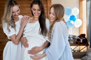 Group of smiling adult women at baby shower