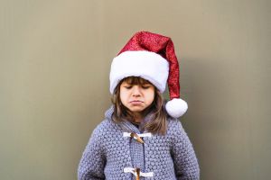 Portrait Of Woman Wearing Hat Against Wall